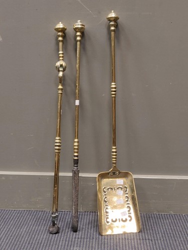 Lot 765 - A set of Georgian brass fire irons comprising...