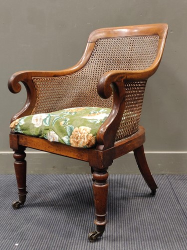 Lot 720 - A 19th century mahogany bergere armchair