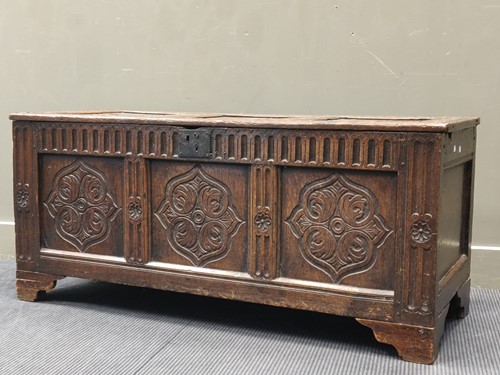 Lot 693 - A 17th century and later three panelled oak...