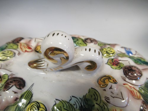 Lot 74 - A Capodimonte tureen and cover with faun and...