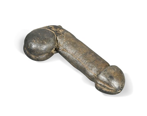 Lot 512 - A large composition cast phallus