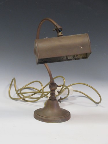 Lot 755 - A 20th century brass desk lamp, with a curved...