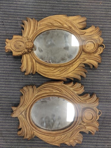 Lot 737 - A pair of carved gilt wood wall mirrors, the...