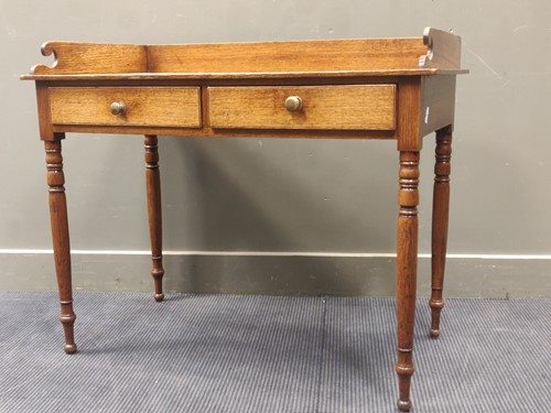 Lot 735 - A 19th century oak washstand, the shaped three-...