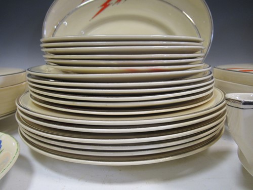 Lot 72 - Clarice Cliff Bizarre dinner china, mainly in 6s