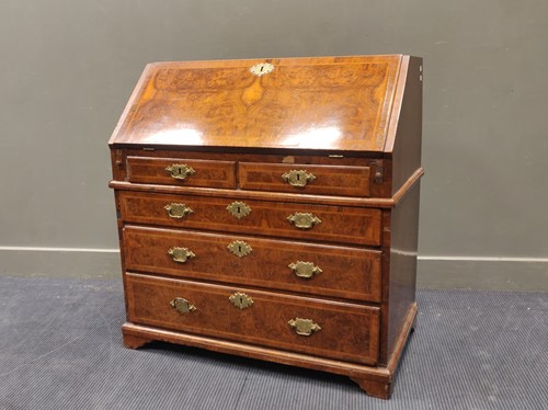 Lot 678 - A Mid-18th century figured walnut bureau the...