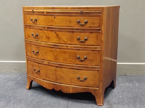 Lot 675 - A modern yew wood small bowfront bachelors...