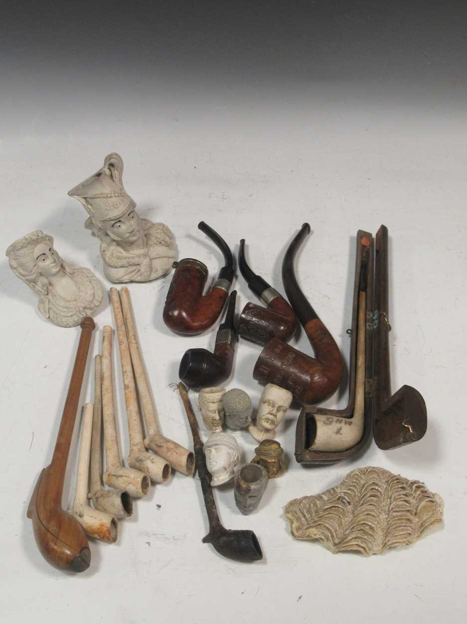 Lot 105 - A large collection of clay and wooden pipes...