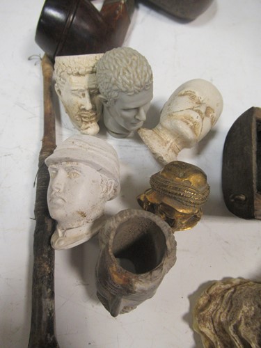 Lot 105 - A large collection of clay and wooden pipes...