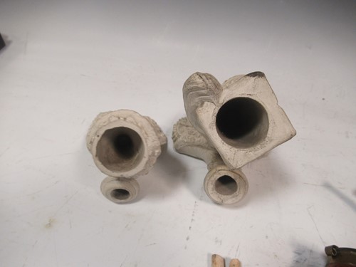 Lot 105 - A large collection of clay and wooden pipes...