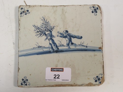 Lot 22 - A delft tile depicting a humorous scene...