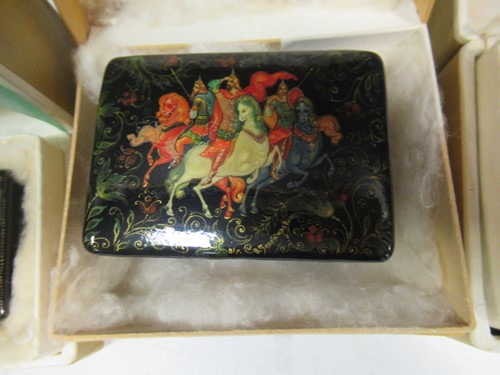 Lot 119 - Five Russian painted lacquer Palekh boxes- The...
