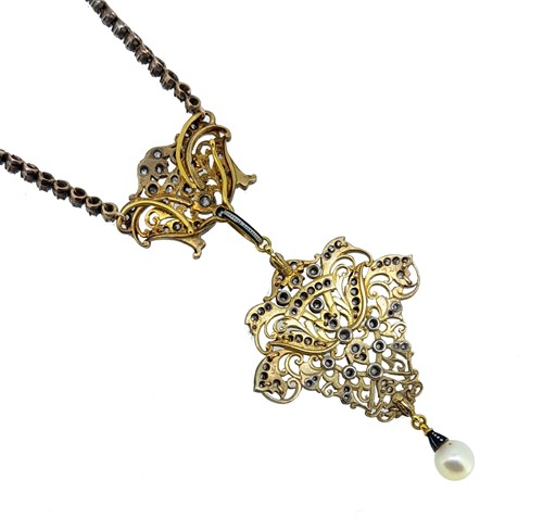 Lot 232 - Carlo Giuliano - A diamond and pearl necklace and brooch en suite