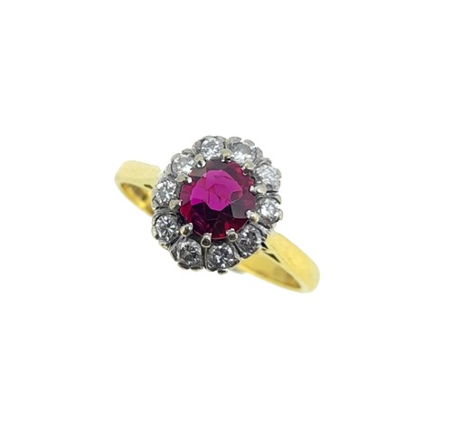 Lot 109 - An 18ct gold ruby and diamond cluster ring