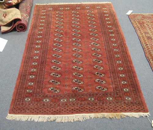 Lot 804 - A Tekke style red ground rug 198 x 127cm