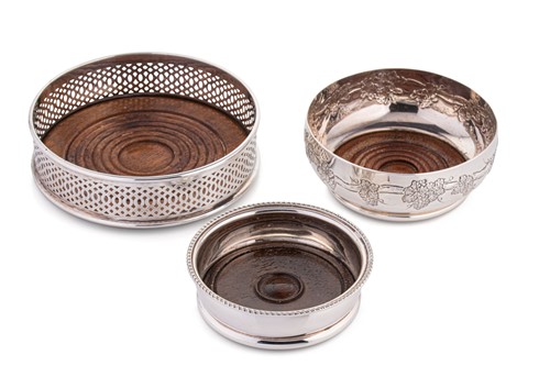 Lot 684 - Three 20th century silver bottle coasters