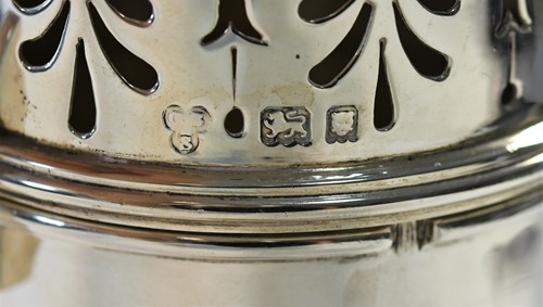 Lot 641 - A George V silver lighthouse style caster