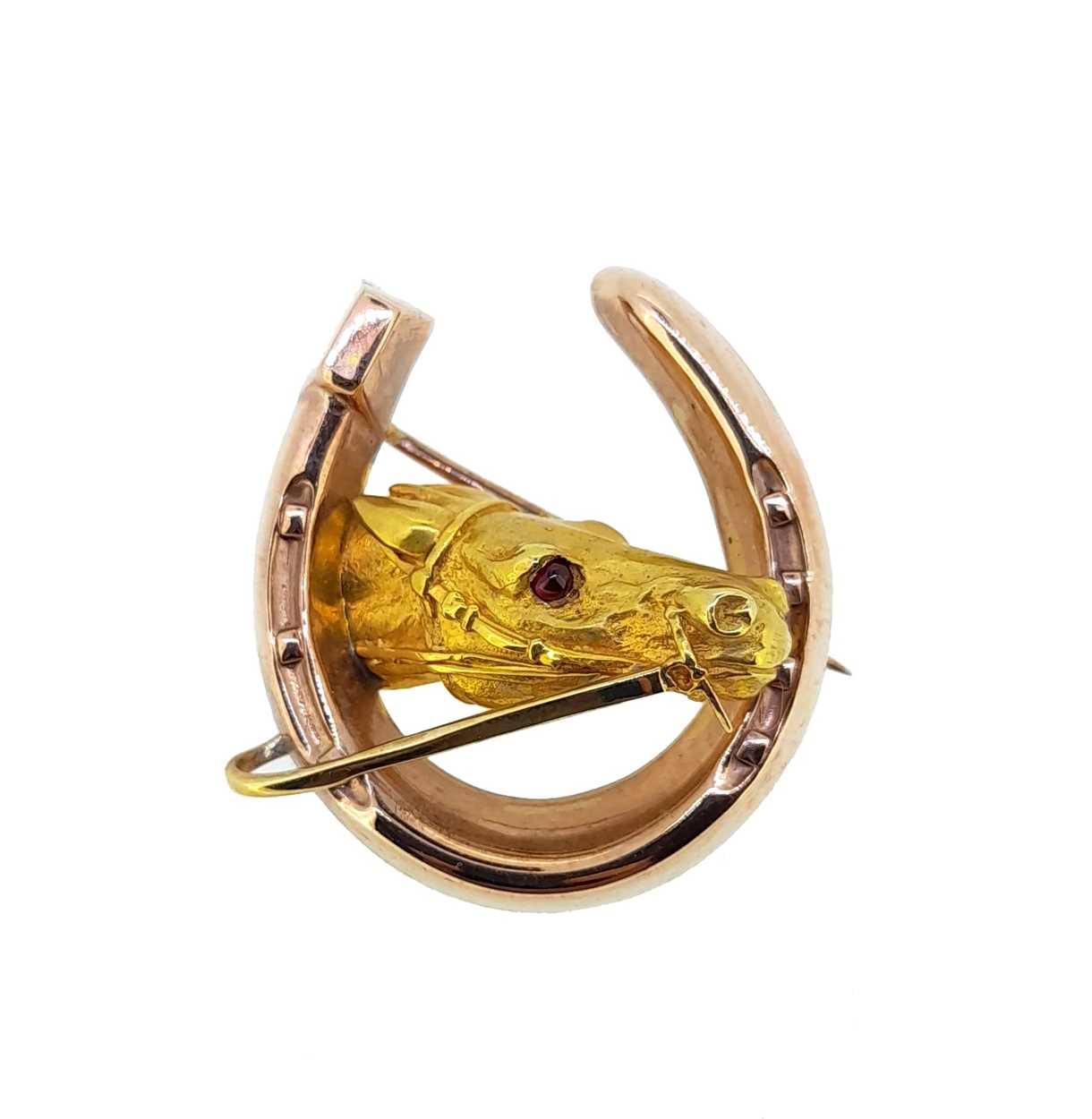 Lot 111 - Alabaster and Wilson - A 9ct gold horse's head brooch