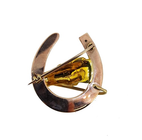Lot 111 - Alabaster and Wilson - A 9ct gold horse's head brooch