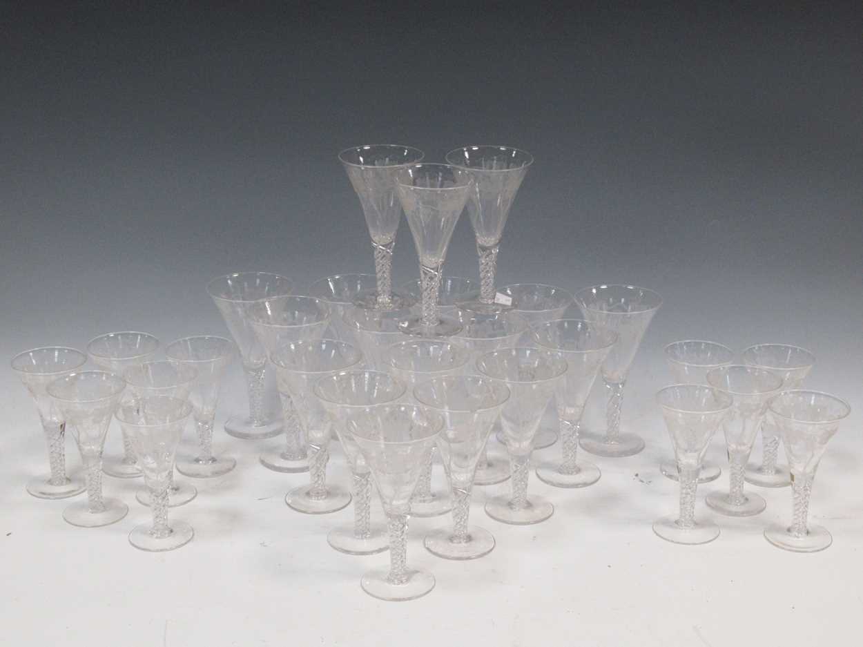 Lot 12 - A set of 29 air-twist drinking glasses, with...