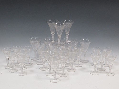 Lot 12 - A set of 29 air-twist drinking glasses, with...