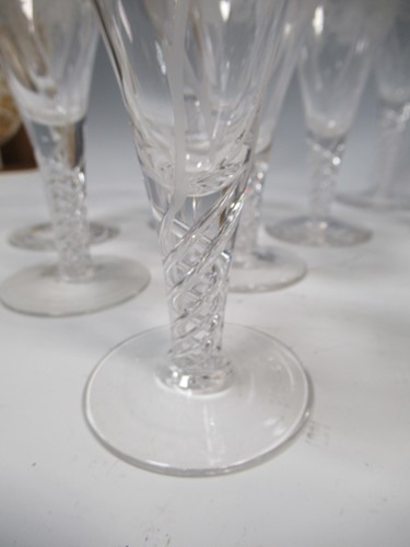 Lot 12 - A set of 29 air-twist drinking glasses, with...