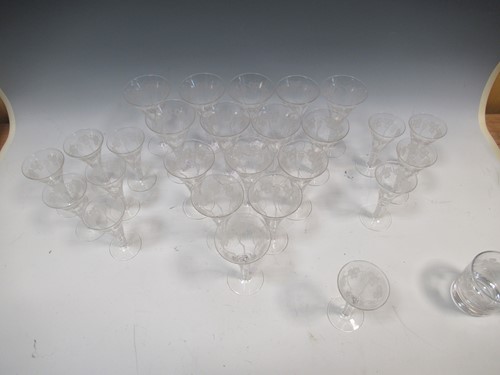 Lot 12 - A set of 29 air-twist drinking glasses, with...