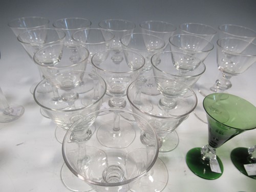 Lot 13 - A set of 17 wine glasses, 20th century, with...