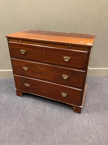 Lot 609 - A 19th century mahogany chest of three long...