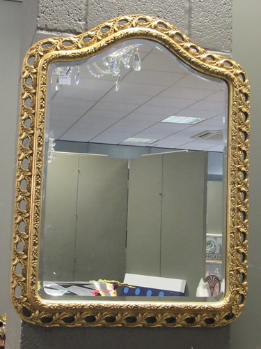 Lot 566 - A gilt framed wall mirror, modern, the arched...