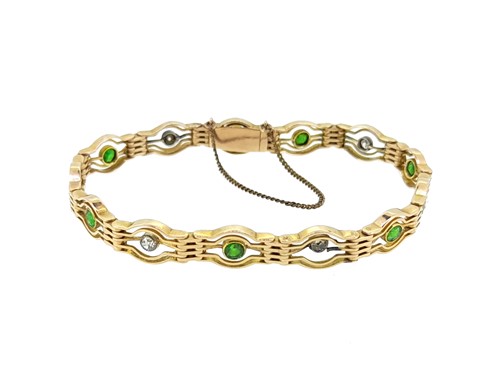 Lot 90 - An Edwardian demantoid garnet and diamond bracelet