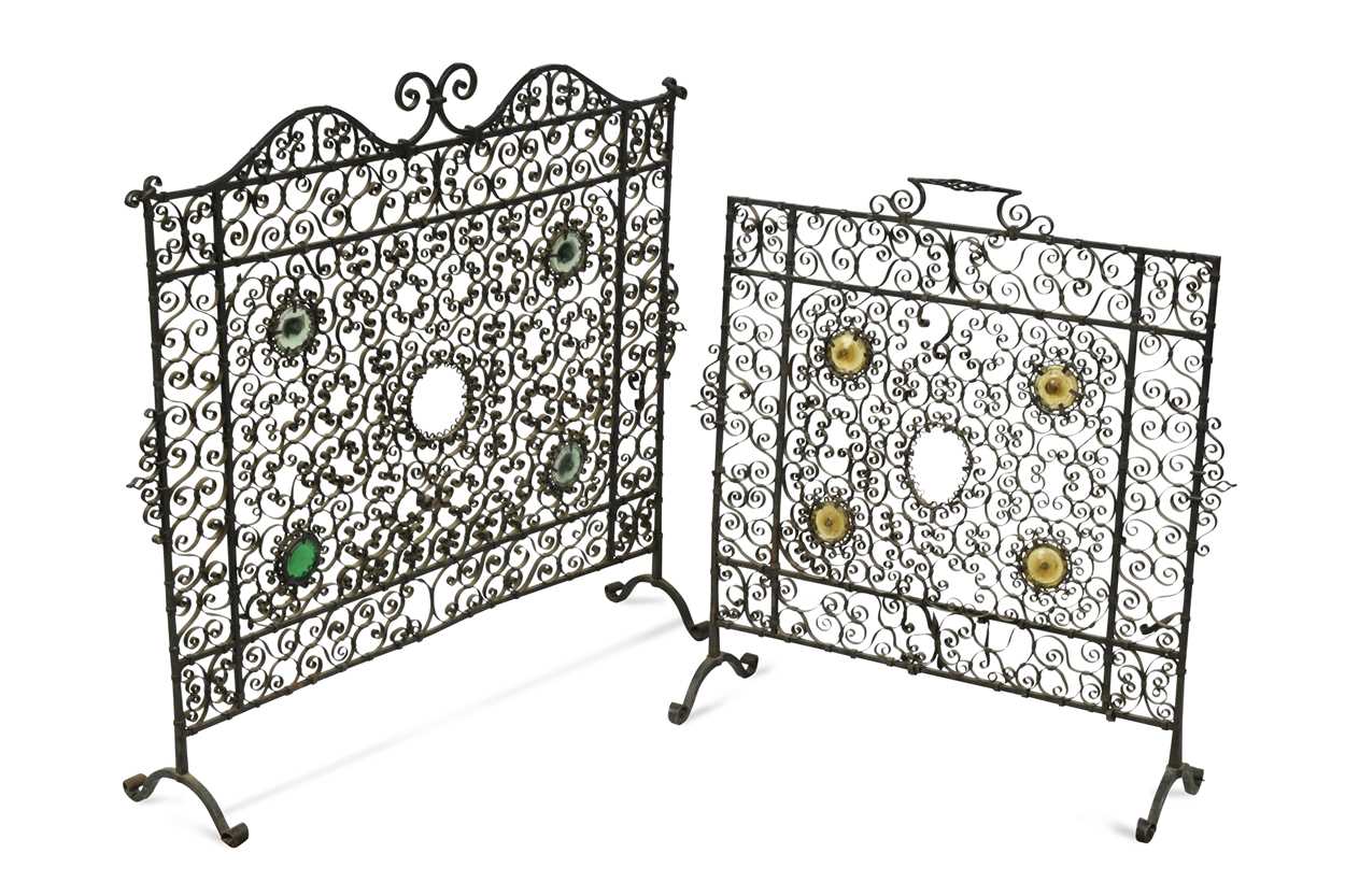 Lot 605 - Two similar wrought iron fire guards, circa 1900