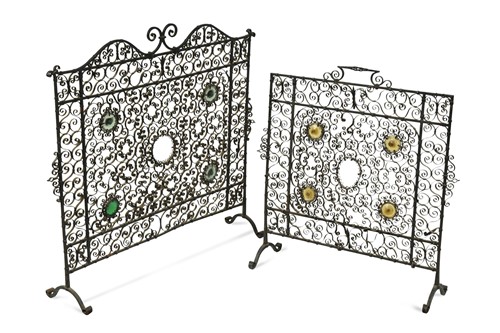 Lot 683 - Two similar wrought iron fire guards, circa 1900