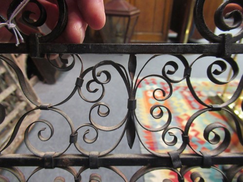 Lot 605 - Two similar wrought iron fire guards, circa 1900