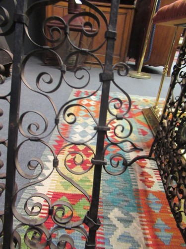 Lot 605 - Two similar wrought iron fire guards, circa 1900