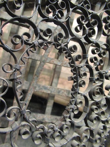Lot 605 - Two similar wrought iron fire guards, circa 1900