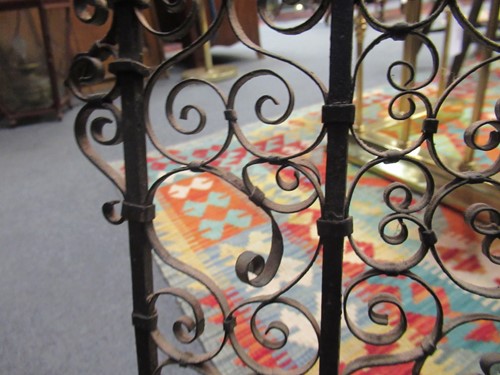 Lot 605 - Two similar wrought iron fire guards, circa 1900