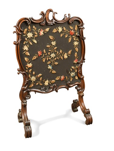 Lot 399 - A mid-Victorian walnut fire screen