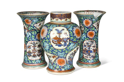 Lot 27 - A Chinese blue and white porcelain clobbered garniture, Qing Dynasty 18th century