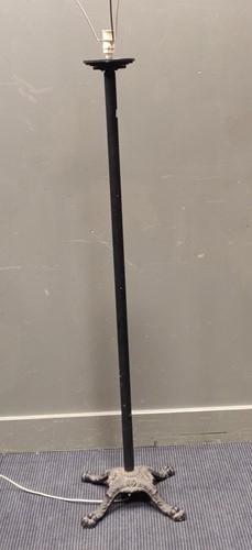 Lot 651 - A standard lamp with four paw-footed base,...
