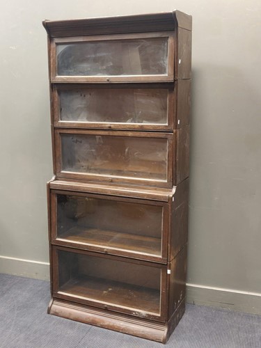 Lot 615 - A Globe Wernicke type stacking oak bookcase,...