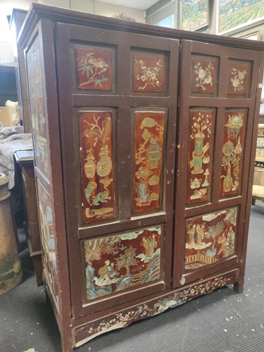 Lot 575 - A Chinese lacquered two door cupboard...