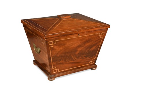 Lot 575 - A flame mahogany sarcophagus shaped cellarette, 19th century