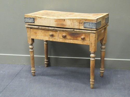 Lot 522 - A butcher’s block on a two drawer pine stand