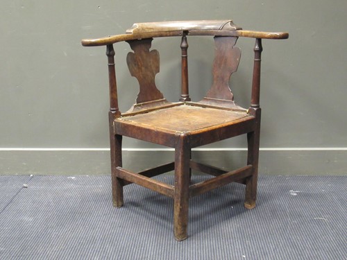 Lot 412 - An elm seated corner chair, mid-18th century,...