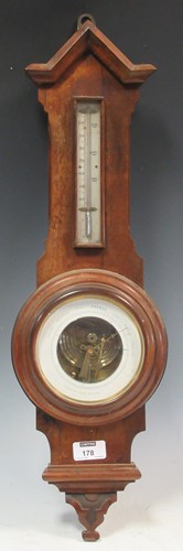 Lot 178 - .A small oak aneroid wall barometer, 60cm high