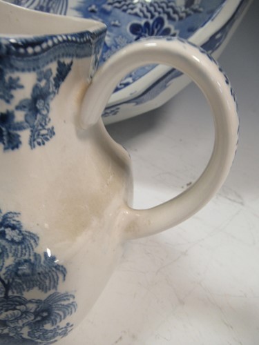 Lot 21 - A Mason's blue and white willow pattern wash...
