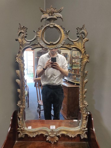 Lot 585 - A giltwood wall mirror made by Palladio, 20th century