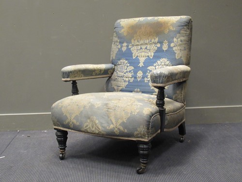 Lot 397 - A Victorian ebonised low armchair