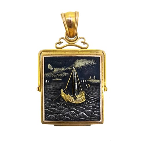 Lot 198 - A damascene swivel hinged locket
